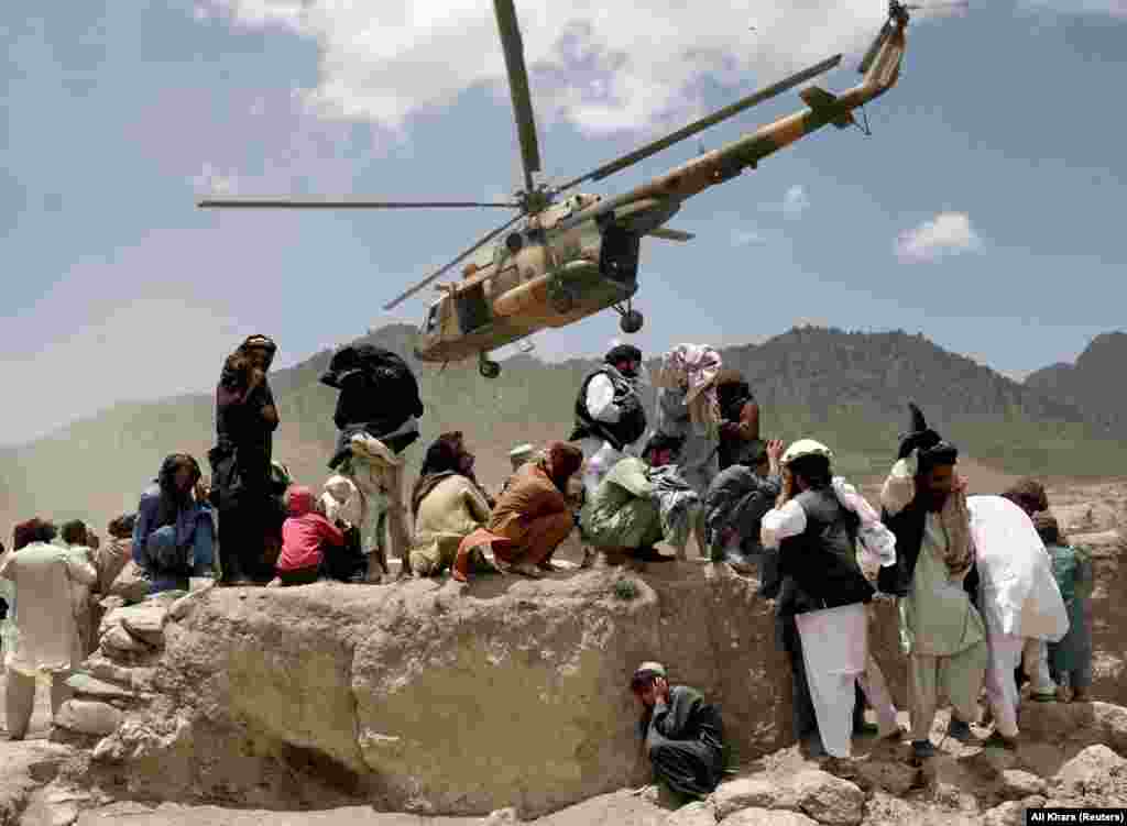 A Taliban helicopter takes off after bringing aid to Gayan. The United Nations said it was deploying medical health teams and supplying medicines, but it said it does not have search-and-rescue capabilities in Afghanistan. &nbsp;