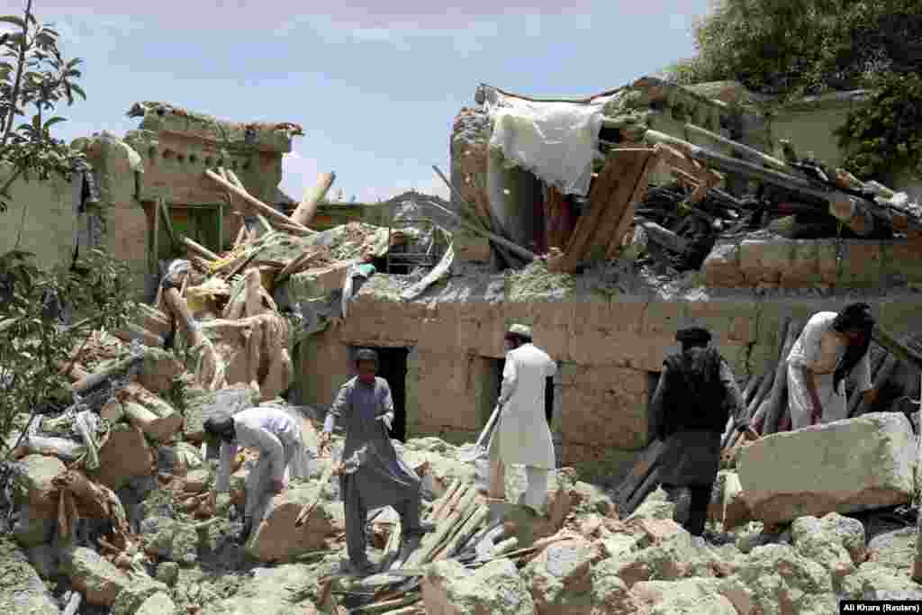 Afghan men search for survivors amid the rubble of a house destroyed by the earthquake, on June 23 in Paktika Province&#39;s Gayan district. The Taliban declared the search for survivors to be over on June 24. The disaster poses a challenge for the Taliban-led government, which is largely isolated as a result of its hard-line Islamist policies toward women and girls. The country had already been battling a severe humanitarian crisis after crucial foreign aid was halted following the Taliban takeover in August 2021.&nbsp;