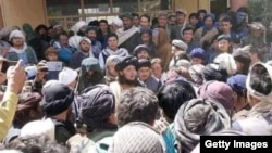 Mehdi Mujahed (center) surrounded by supporters in Balkhab.