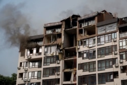 Последствия попадания российской ракеты в жилой дом в Киеве. 26 июня 2022 года