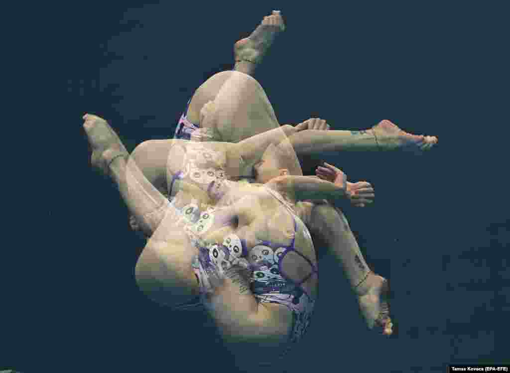 This multiple exposure image shows Sofiia Lyskun of Ukraine in the preliminary round of the women&rsquo;s 10-meter platform diving at the 19th FINA World Championships in Budapest on June 26.