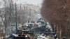 Ukraine -- destroyed military vehicles on a street, as Russia's invasion of Ukraine continues, in the town of Bucha in the Kyiv region