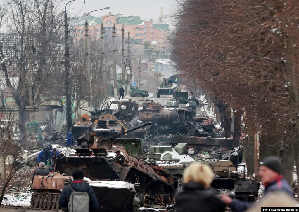 A column of destroyed vehicles on a street in Bucha on March 1