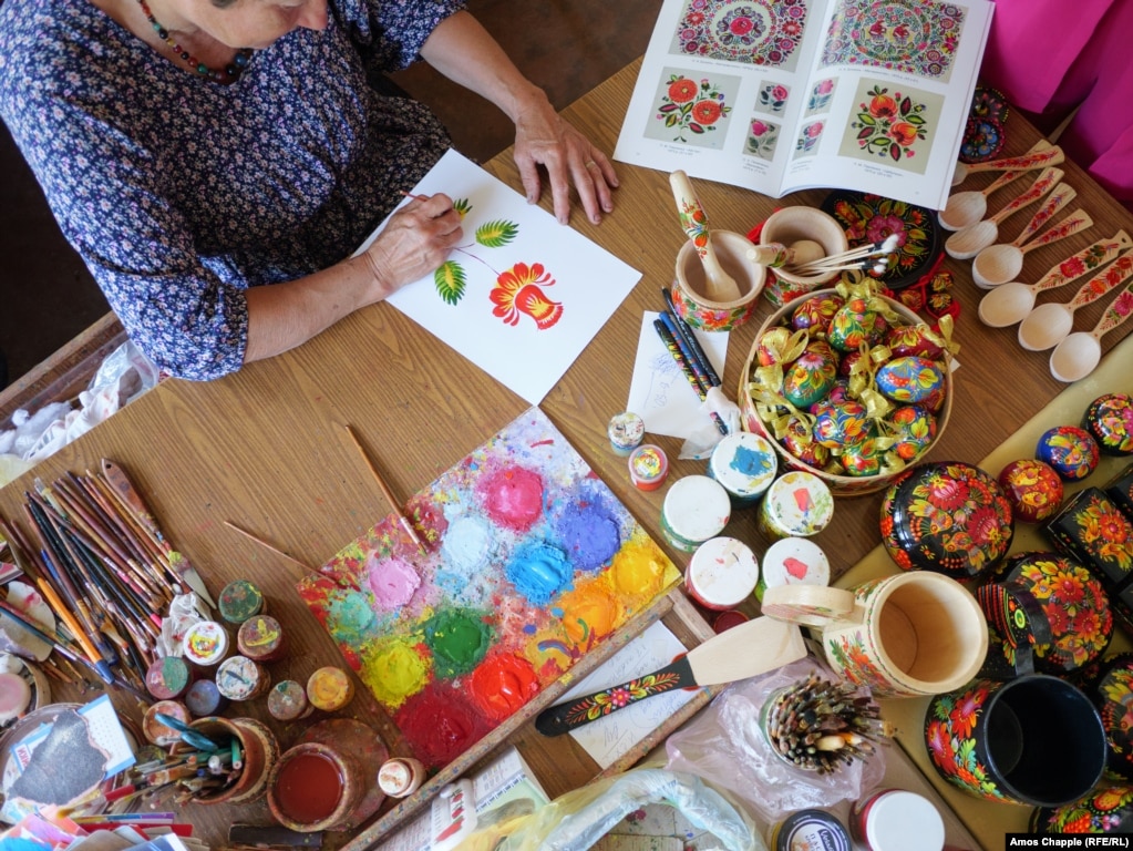 Artist, master artist, of Petrykivkas-style drawings, Natalya Rybak, at work, on June 27.