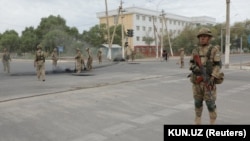 Uzbek soldiers patrol the streets of Nukus on July 3.