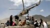A Taliban helicopter takes off after bringing aid to the site of the earthquake in Gayan in Paktika Province on June 23.