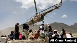 A Taliban helicopter takes off after bringing aid to the site of the earthquake in Gayan in Paktika Province on June 23.