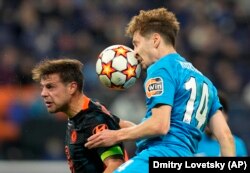 Zenit's Daler Kuzyaev (right) heads the ball ahead of Chelsea's Cesar Azpilicueta during the Champions League Group H match between Zenit St. Petersburg and Chelsea at Gazprom Arena in St. Petersburg in December.