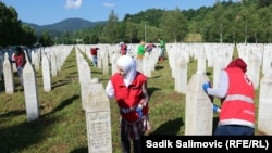 On June 18, volunteers clean the tombstones of victims of the Srebrenica massacre, in which 8,000 mostly Muslim men and boys were killed by Bosnian Serb forces. International rulings have deemed it a genocide.