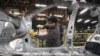 A worker assembles a new model at the Nissan plant in outside St. Petersburg.