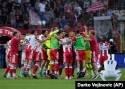 Red Star players celebrate after winning Serbia's national cup final against Partizan in Belgrade on May 26.