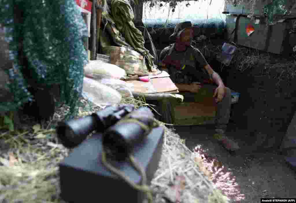 A Ukrainian soldier sits in a trench on the front line near Avdiyivka on June 18. Located 6&nbsp;kilometers north of Donetsk, Avdiyivka has long been a major impediment to Moscow&#39;s military objectives, as it is directly in the path of Russian forces attempting to advance and gain control in the east.