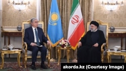 Kazakh President Qasym-Zhomart Toqaev met with Iranian President Ebrahim Raisi in Tehran on June 19.