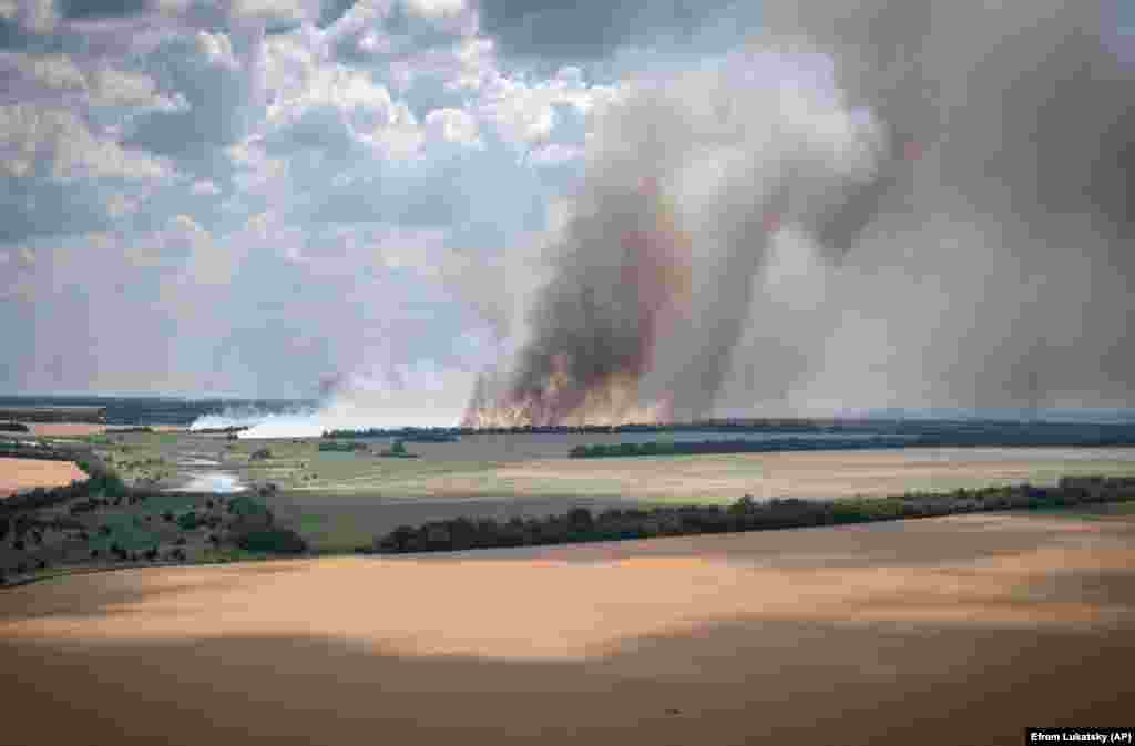 Smoke rises from the front lines where a fierce battle raged between Ukrainian and Russian troops in the Dnipropetrovsk region of Ukraine on July 4.