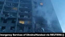 The smoldering facade of a residential building in Ukraine's Odesa region that was hit by a rocket on the night of June 30-July 1.