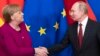 German Chancellor Angela Merkel and Russian President Vladimir Putin shake hands after their joint news conference following talks in the Kremlin in January 2020.