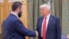 US President Donald Trump shakes hands with Syria's President Ahmad al-Sharaa in Saudi Arabia on May 14