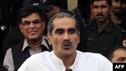 Pakistani Minister for Railways Khawaja Saad Rafique talks to the media outside a court in Lahore on May 4.