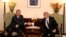 Armenian President Serzh Sarkisian (R) shakes hands with his Azerbaijan's counterpart Ilham Aliyev (L) during their meeting in Chisinau on October 8, 2009.