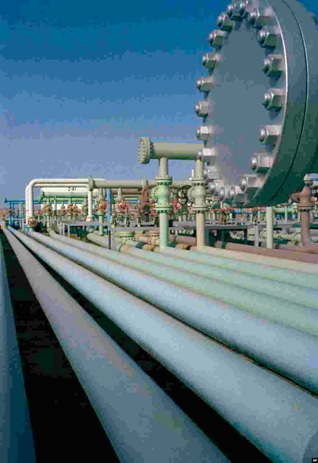 This is a view of the pipes at the Abadan oil refinery in Iran, seen July 1971. Different color pipes indicate different processes. (AP Photo/Horst Faas)