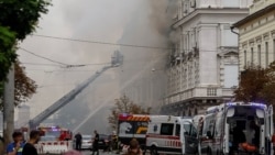Firefighters work at the headquarters of Ukraine's SBU security service after a Russian drone strike in Kyiv on September 4.