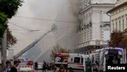 Firefighters work at the headquarters of Ukraine's SBU security service after a Russian drone strike in Kyiv on September 4.