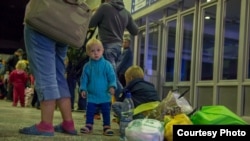 Ukrainian refugees arrive in the Siberian city of Magadan on August 26.