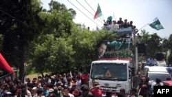 Supporters of Pakistani cricketer-turned-politician Imran Khan.