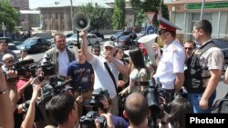 Armenia - Activists protest outside the Public Services Regulatory Commission against a 10 percent increase in electricity prices, Yerevan, 1Jul2014.