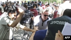 Georgian police battle opposition protesters in Tbilisi.