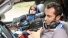 Iranian filmmaker Ali Ahmadzadeh behind the scenes of his first movie, Kami's Party.