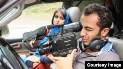 Iranian filmmaker Ali Ahmadzadeh behind the scenes of his first movie, Kami's Party.