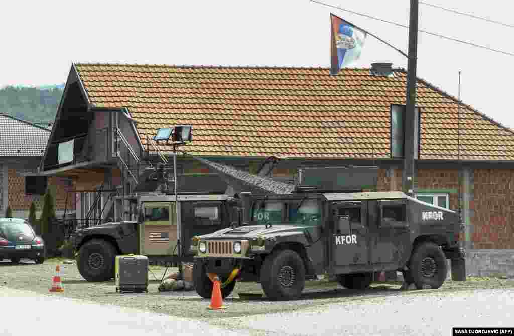 American Humvees from the NATO-led peacekeeping mission in Kosovo patrol near Leposavic on September 1. U.S. NATO peacekeepers were seen in force on the streets of northern Kosovo on September 1 as tensions reemerged in the region over a countdown announced for the enforcement of car license-plate requirements. &nbsp;