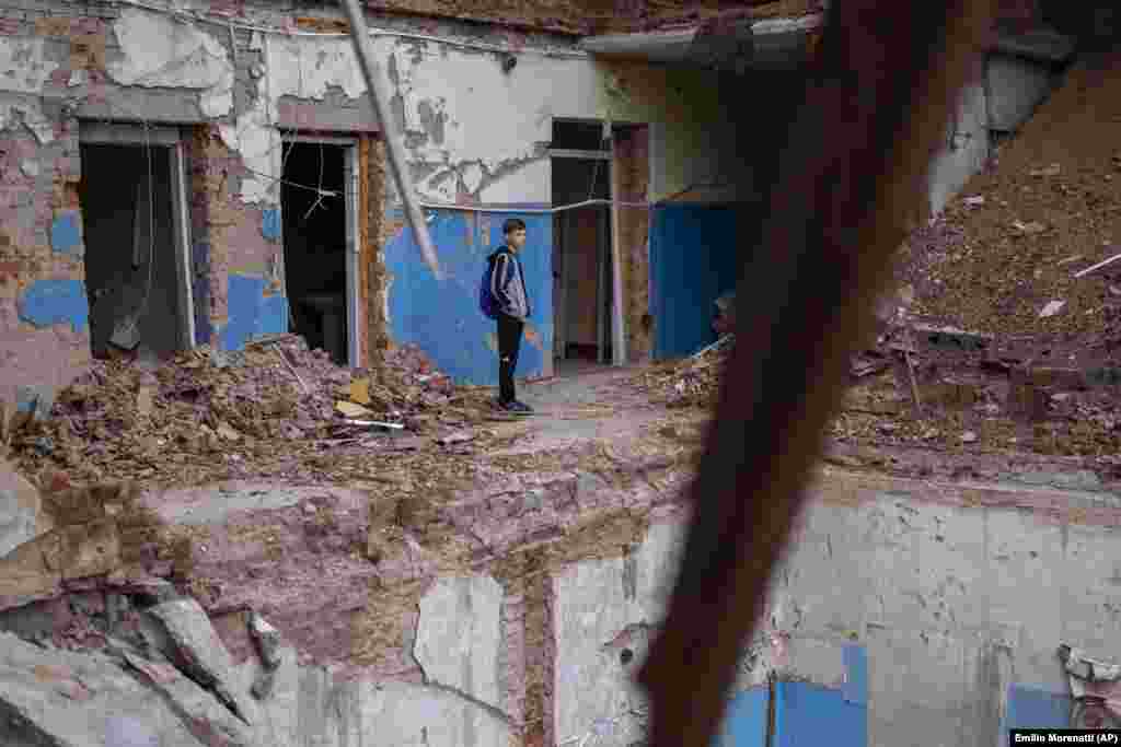 &quot;When I&#39;m at school, I think about the person who died in the debris. I feel deeply sorry for her,&quot; said Mykhaylo Kravchenko, 12, as he views a hole where his computer class once was.