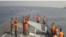 Iran aired footage that appeared to show more than a dozen Iranian Navy personnel pushing two drones into the sea from the deck of their vessel.