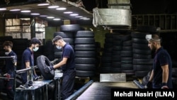 Workers at a tire company (illustrative photo)