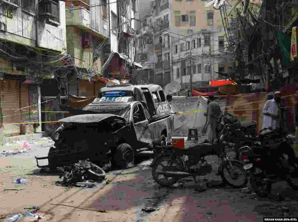 The aftermath of an explosion in Karachi, Pakistan, on May 17. One person was killed and at least a dozen were injured, including police officers, when an improvised explosive device went off near a police van.