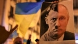 UKRAINE-CRISIS/Banner with Putin-Hitler photo at protest in Spain