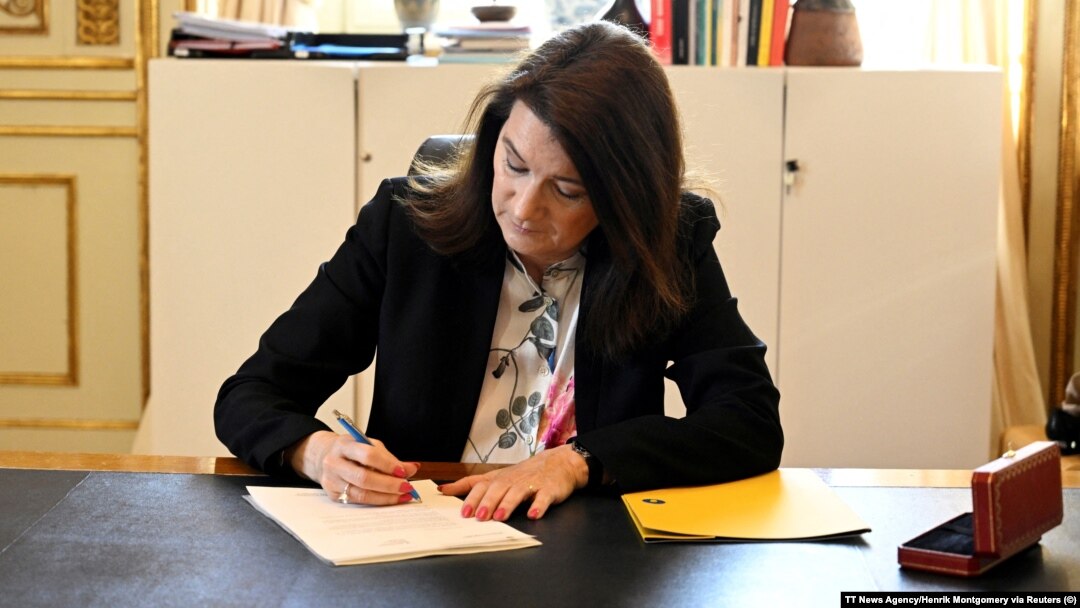 Sweden's Foreign Minister Ann Linde signs the country's application for NATO membership on May 17.