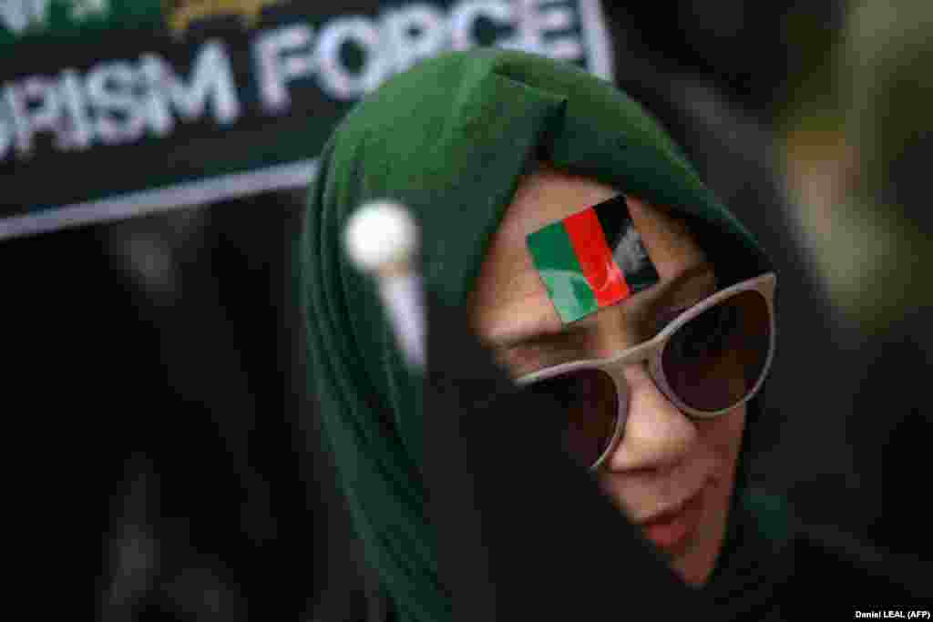 A demonstrator attends a protest against Taliban rule in Afghanistan in front of Downing Street in central London.