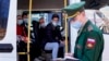 Russian conscripts board a shuttle bus at an army recruitment center before departing for military service. (file photo)