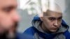 Vadim Shishimarin, 21, sits inside a defendants' cage during a court hearing in Kyiv on May 13.