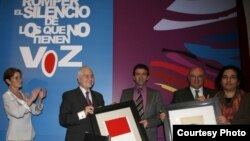 Nazila Ghanea (far right) accepts the Spanish Bar Association's Human Rights Award on behalf of Nasrin Sotoudeh. Another honoree, Mohammad Mostafaei, is second from the right.