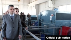 Armenia - Prime Minister Tigran Sarkisian (L) and Patrick Fine, vice-president of the U.S. Millennium Challenge Corporation, visit a newly constructed pumping station in Ararat province, 3Oct2011.