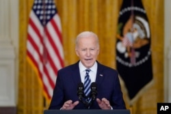 U.S. President Joe Biden announces sanctions against Russia during a press conference in Washington on February 24.
