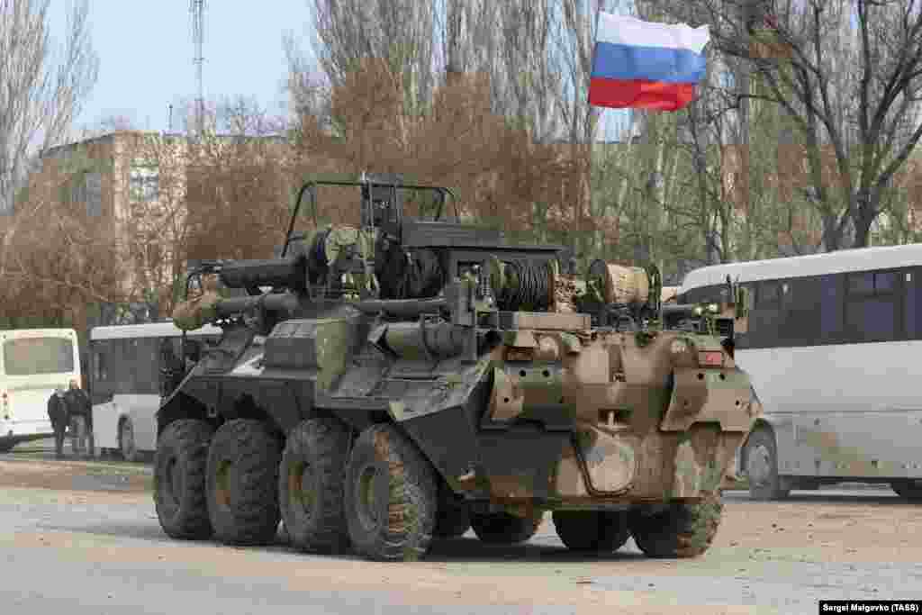 A Russian armored vehicle moves across the town of Armyansk in northern Crimea on February 24.