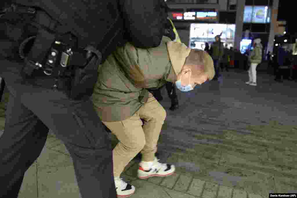 Police detain a protestor in Moscow.&nbsp;