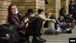 Ukrainians take shelter in a subway station after air-raid sirens in Kyiv.