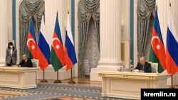 Russia - Russian President Vladimir Putin and his Azerbaijani counterpart Ilham Aliyev sign a joint declaration on "allied cooperation" between their countries, Moscow, February 22, 2022.