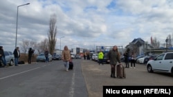 Ukrainian refugees at Moldova's Palanca border checkpoint on February 24. 